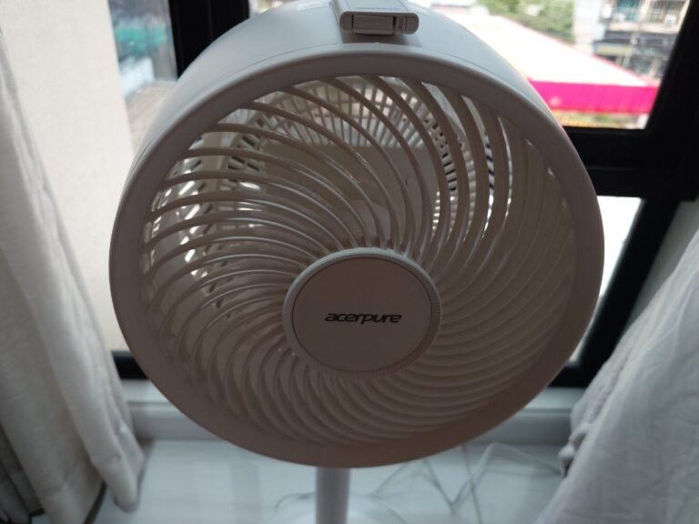 Front view of the Acerpure Cozy F2 fan with its remote resting on top