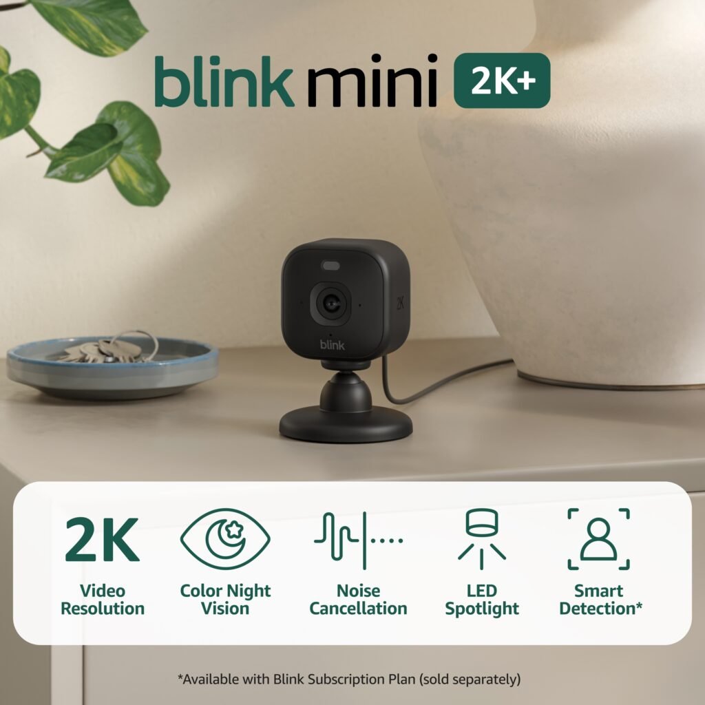 Blink Mini 2K+ black plug-in camera with feature icons — promotional product image